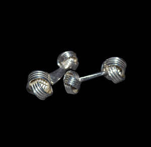 Silver made cuff links with a triple line knot