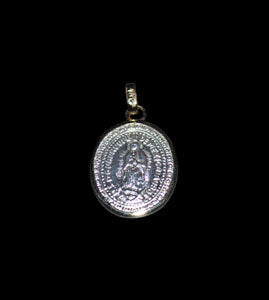 Small silver made with oval shape Guadalupe Madonna medallion