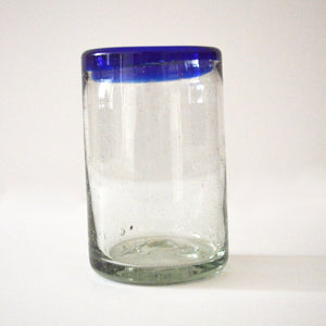 Hand blown juice glass with a blue rim