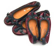 Mom and daughter mustache shoes.