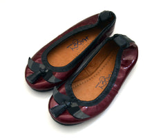 Mom and daughter mustache shoes.
