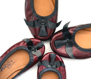 Mom and daughter mustache shoes.