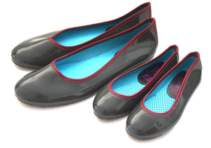 Mom and daughter gray/ burgundy patent leader style shoes.